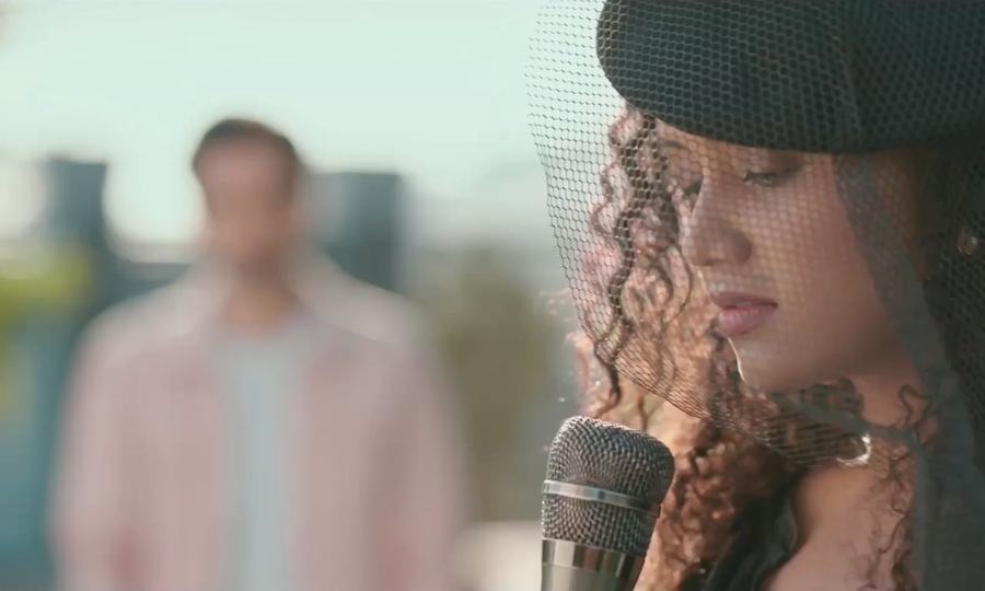Pranali singing into a studio microphone in Fuh Se Fantasy.